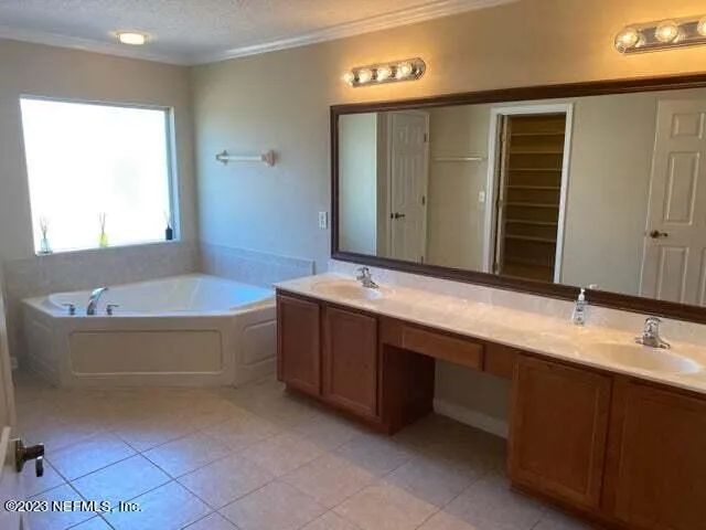 a bathroom with a bathtub and shower
