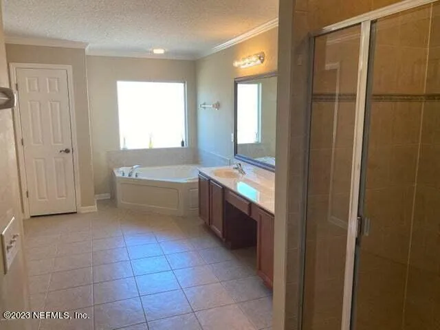 a bathroom with a double vanity sink and mirror