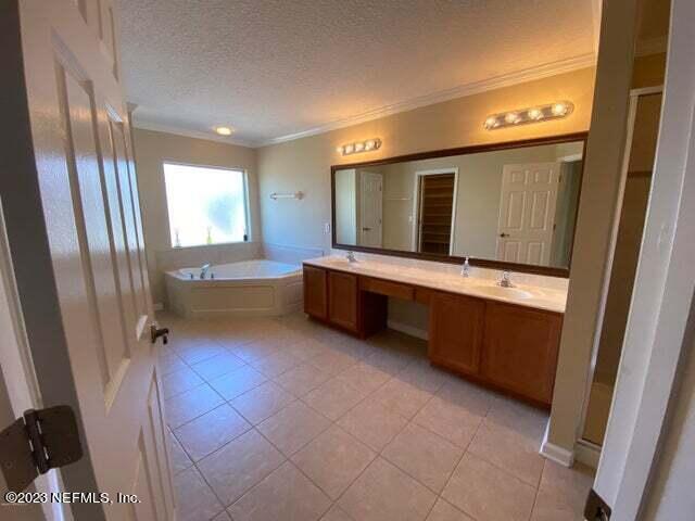 3301 Turkey Creek Drive Green Cove Springs, FL 32043 - Photo 24 of 36 a bathroom with a double vanity sink and mirror