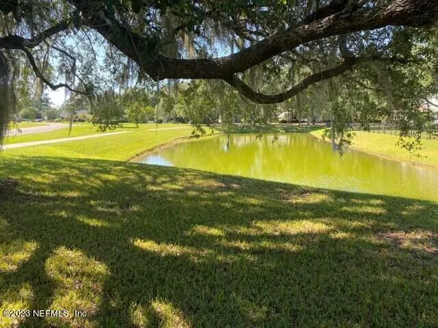 a view of a house with backyard porch and garden