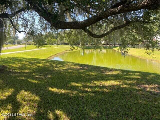 3301 Turkey Creek Drive Green Cove Springs, FL 32043 - Photo 29 of 36 a view of a swimming pool with an outdoor space and seating area