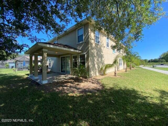 3301 Turkey Creek Drive Green Cove Springs, FL 32043 - Photo 30 of 36 a view of a house with backyard porch and garden