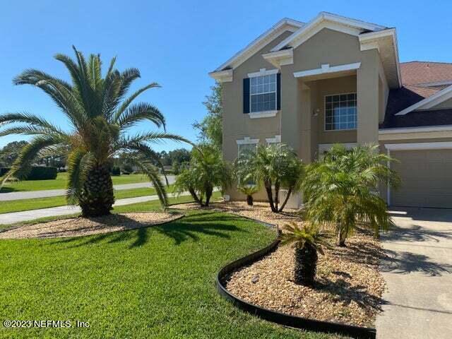 3301 Turkey Creek Drive Green Cove Springs, FL 32043 - Photo 3 of 36 a view of a house with a backyard porch and sitting area