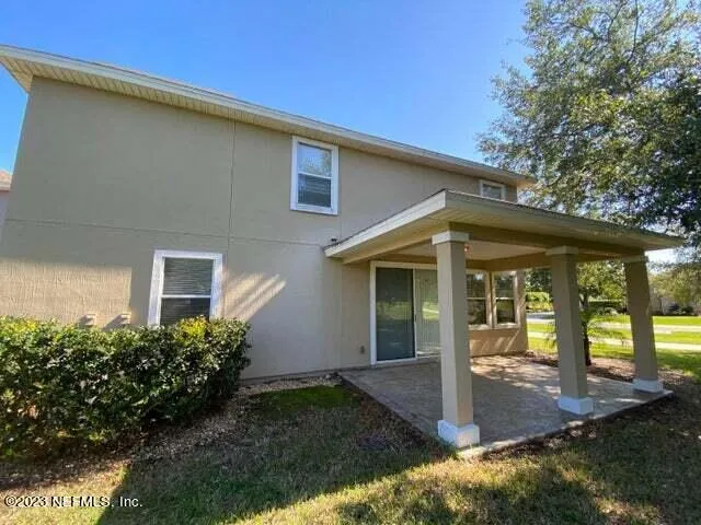 a view of a swimming pool with an outdoor space and seating area