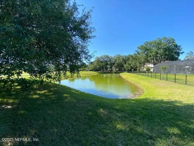a view of a swimming pool with a lake view