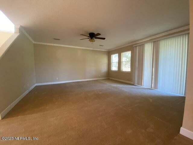 3301 Turkey Creek Drive Green Cove Springs, FL 32043 - Photo 9 of 36 an empty room with windows and fan