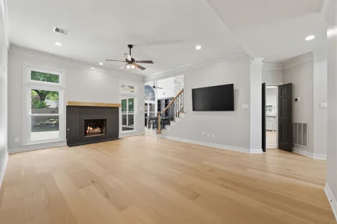 a kitchen with stainless steel appliances granite countertop a stove a sink a oven a dining table and chairs