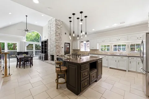 a view of a dining room with furniture window and outside view