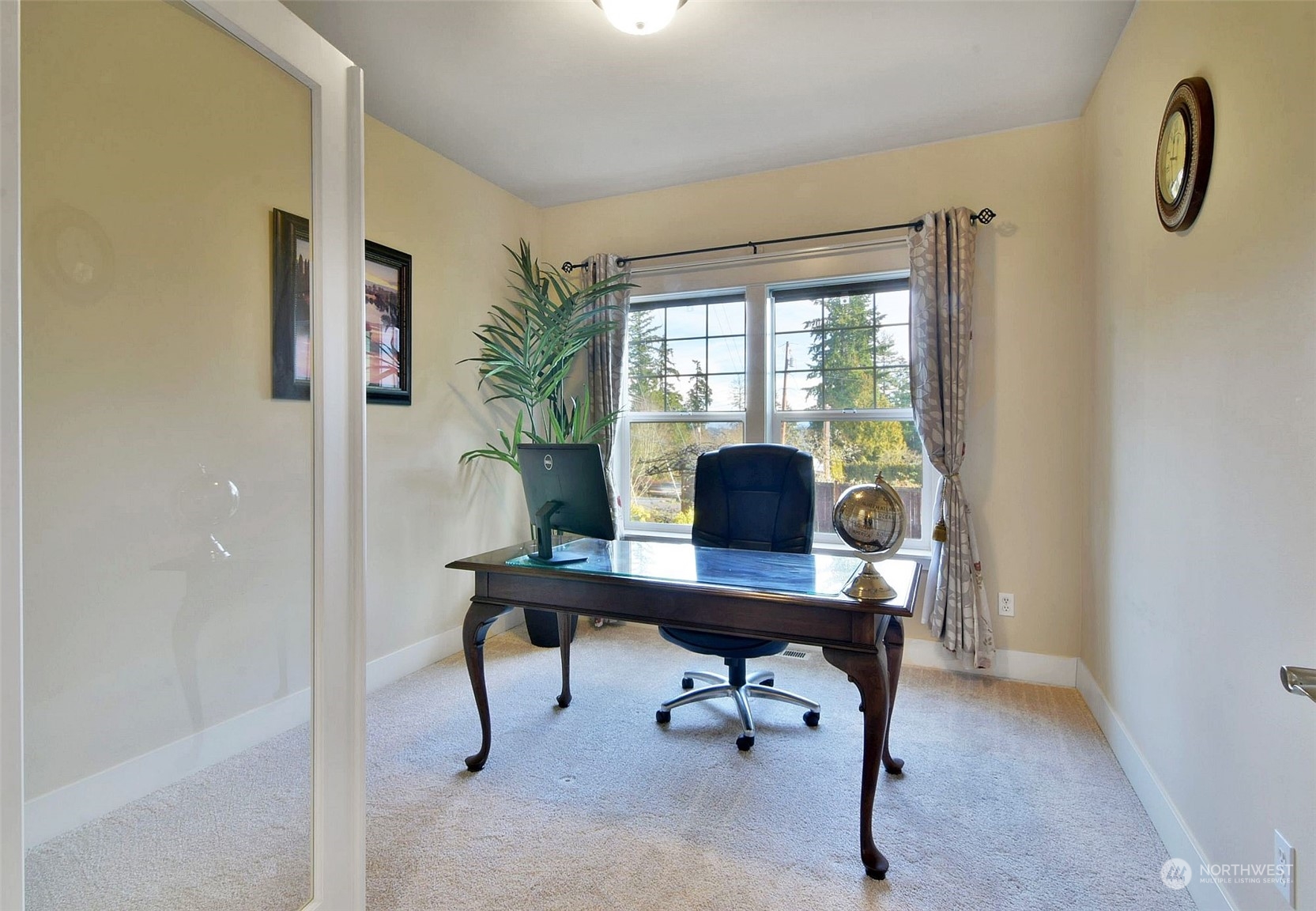 12 228th Street Southeast Bothell, WA 98021 - Photo 12 of 33 a view of a workspace with furniture and a window