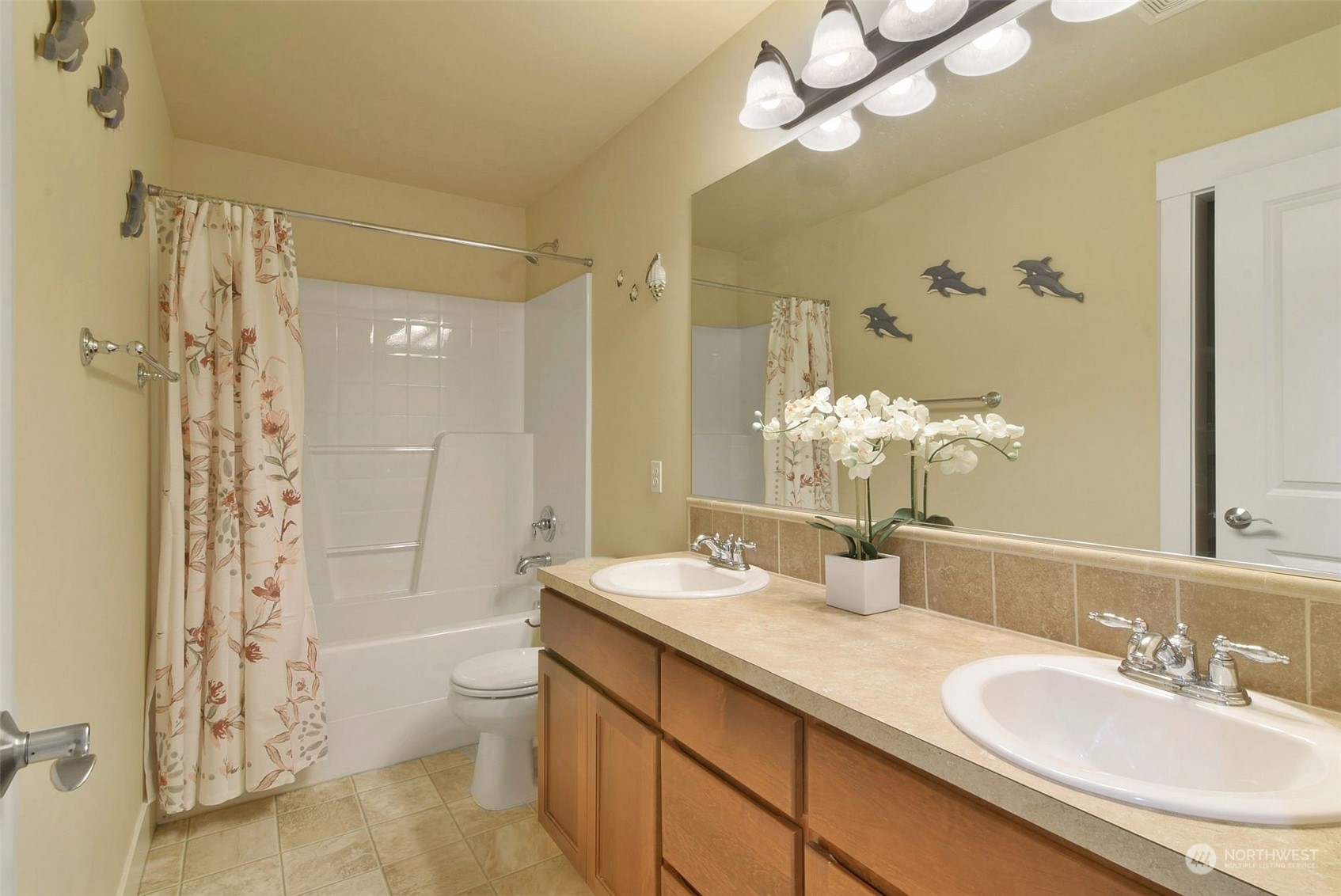 12 228th Street Southeast Bothell, WA 98021 - Photo 25 of 33 a bathroom with a granite countertop sink a toilet and shower
