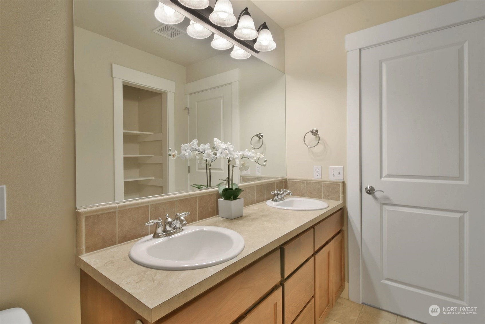 12 228th Street Southeast Bothell, WA 98021 - Photo 26 of 33 a bathroom with a sink vanity and a mirror