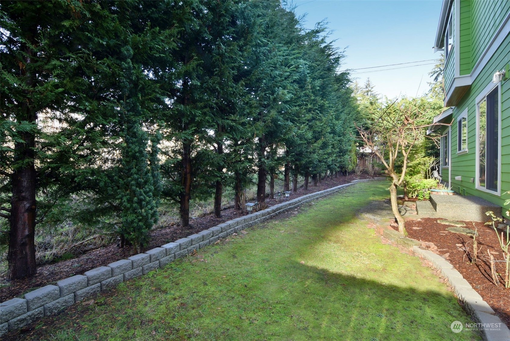 12 228th Street Southeast Bothell, WA 98021 - Photo 28 of 33 a view of a backyard with a garden