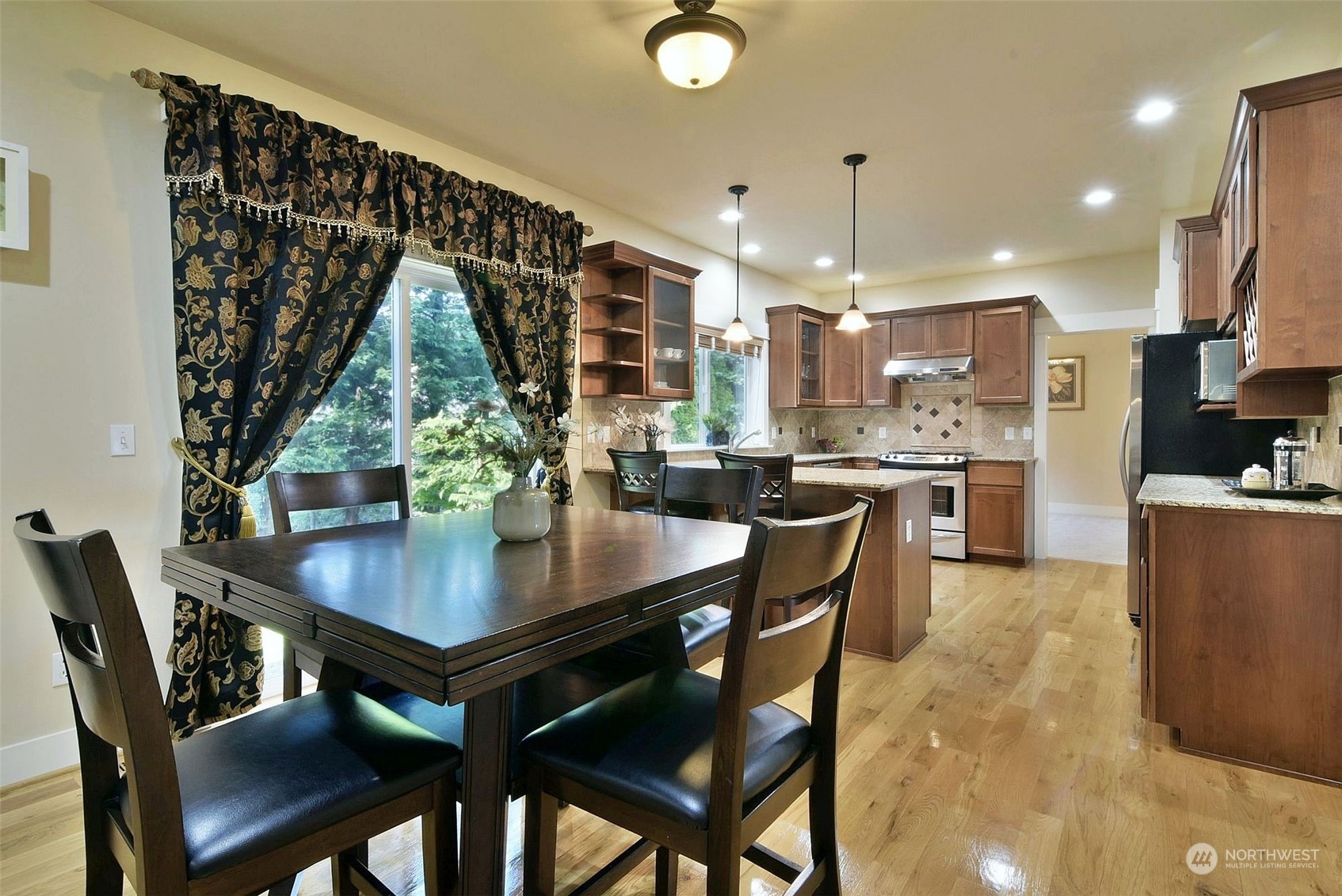 12 228th Street Southeast Bothell, WA 98021 - Photo 9 of 33 a dining room with furniture and window