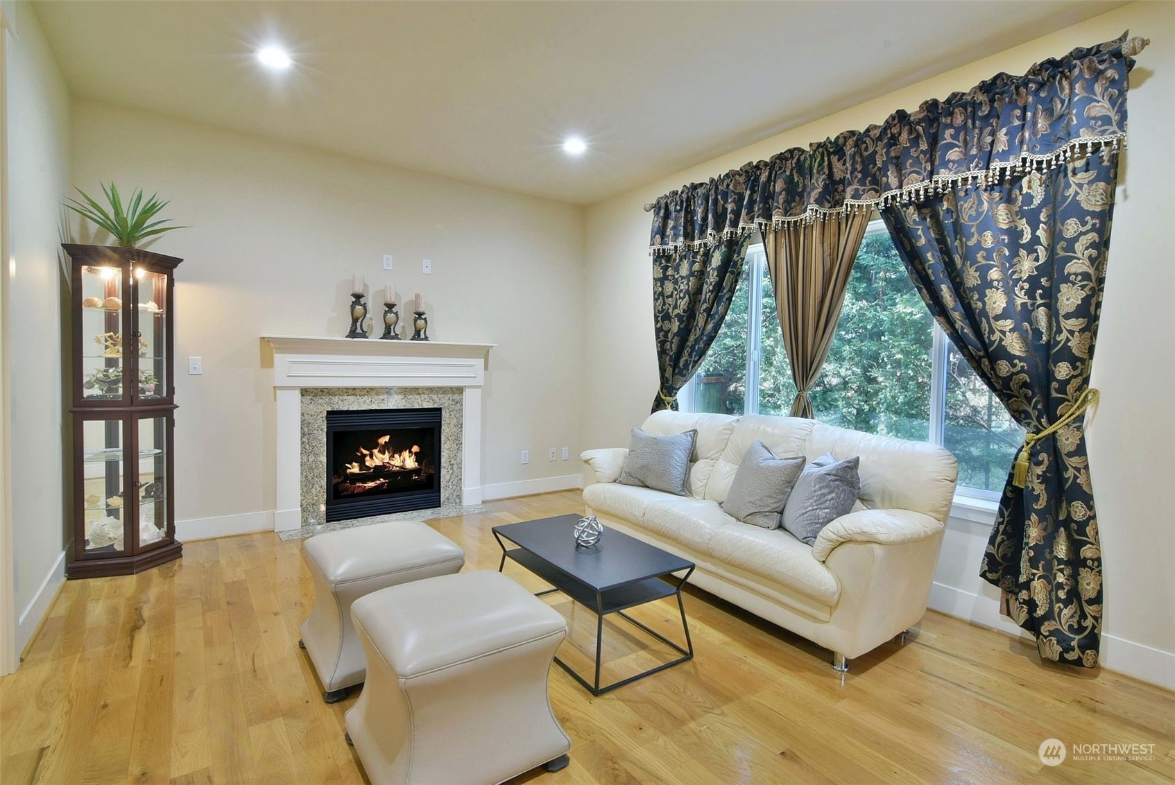 12 228th Street Southeast Bothell, WA 98021 - Photo 10 of 33 a living room with furniture and a fireplace