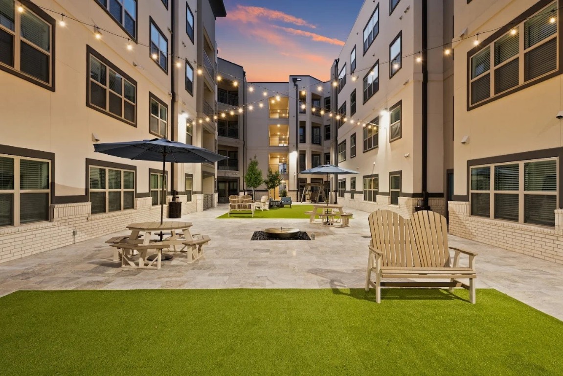 1888 Brittmoore Road, Unit 1448 Houston, TX 77043 - Photo 8 of 16 a view of a building with backyard