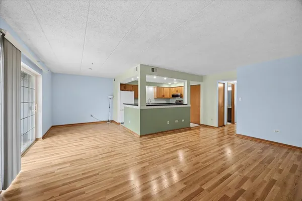 a view of a kitchen with a sink and a microwave