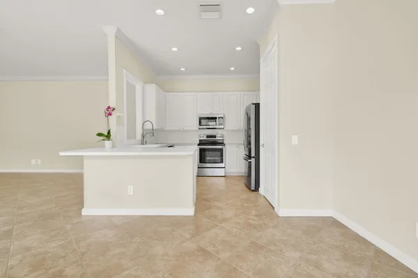 a view of a kitchen with microwave and stove