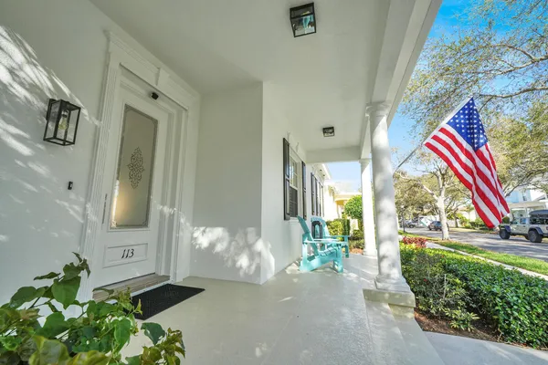 a view of an entryway with wooden floor