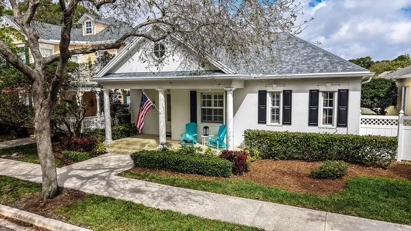 front view of a house with a yard