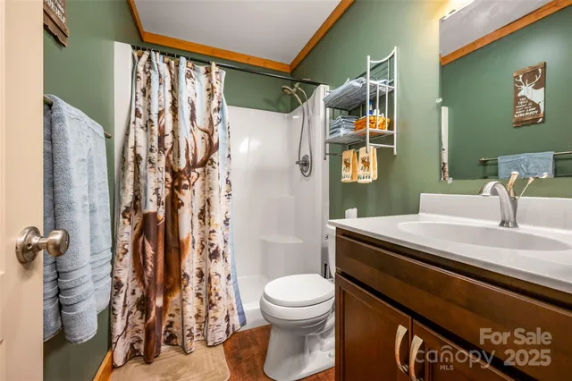 a view of walk in closet with clothes