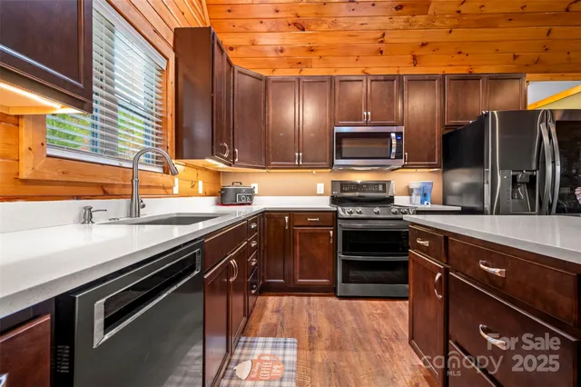 a living room with furniture a ceiling fan and a rug