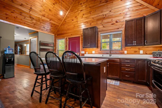 a balcony with wooden floor outdoor seating and city view