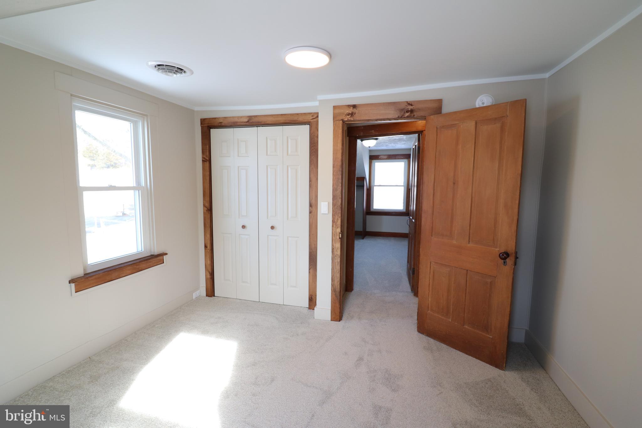 985 South Ridge Road Denver, PA 17517 - Photo 26 of 36 an empty room with windows and closet