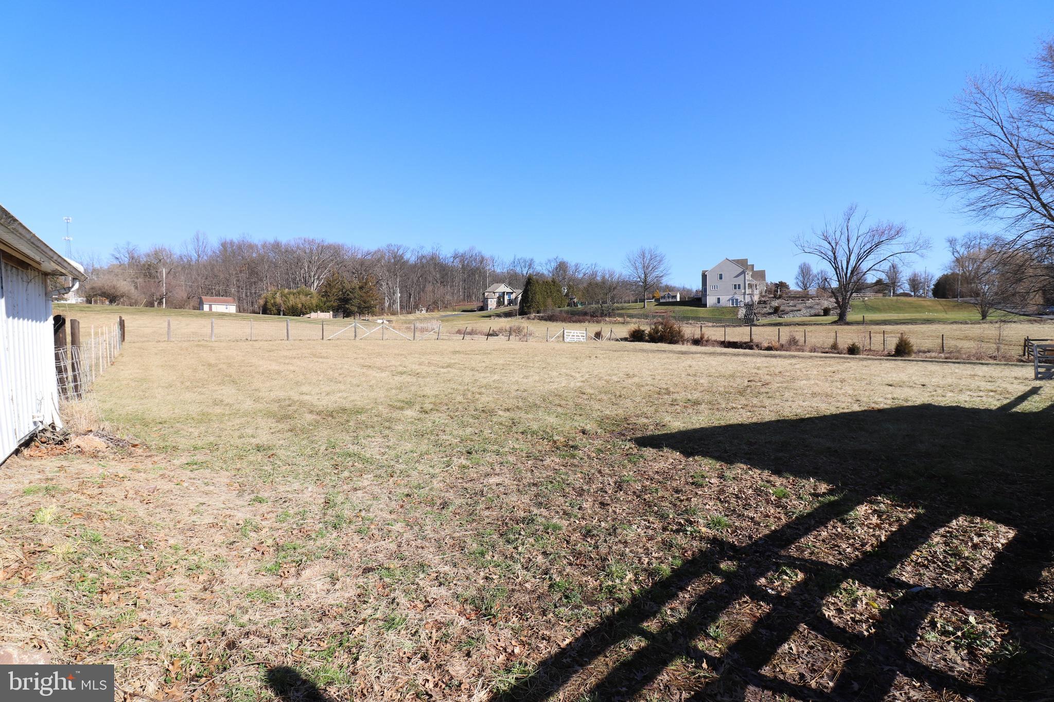 985 South Ridge Road Denver, PA 17517 - Photo 35 of 36 a view of a lake with beach and house in the background