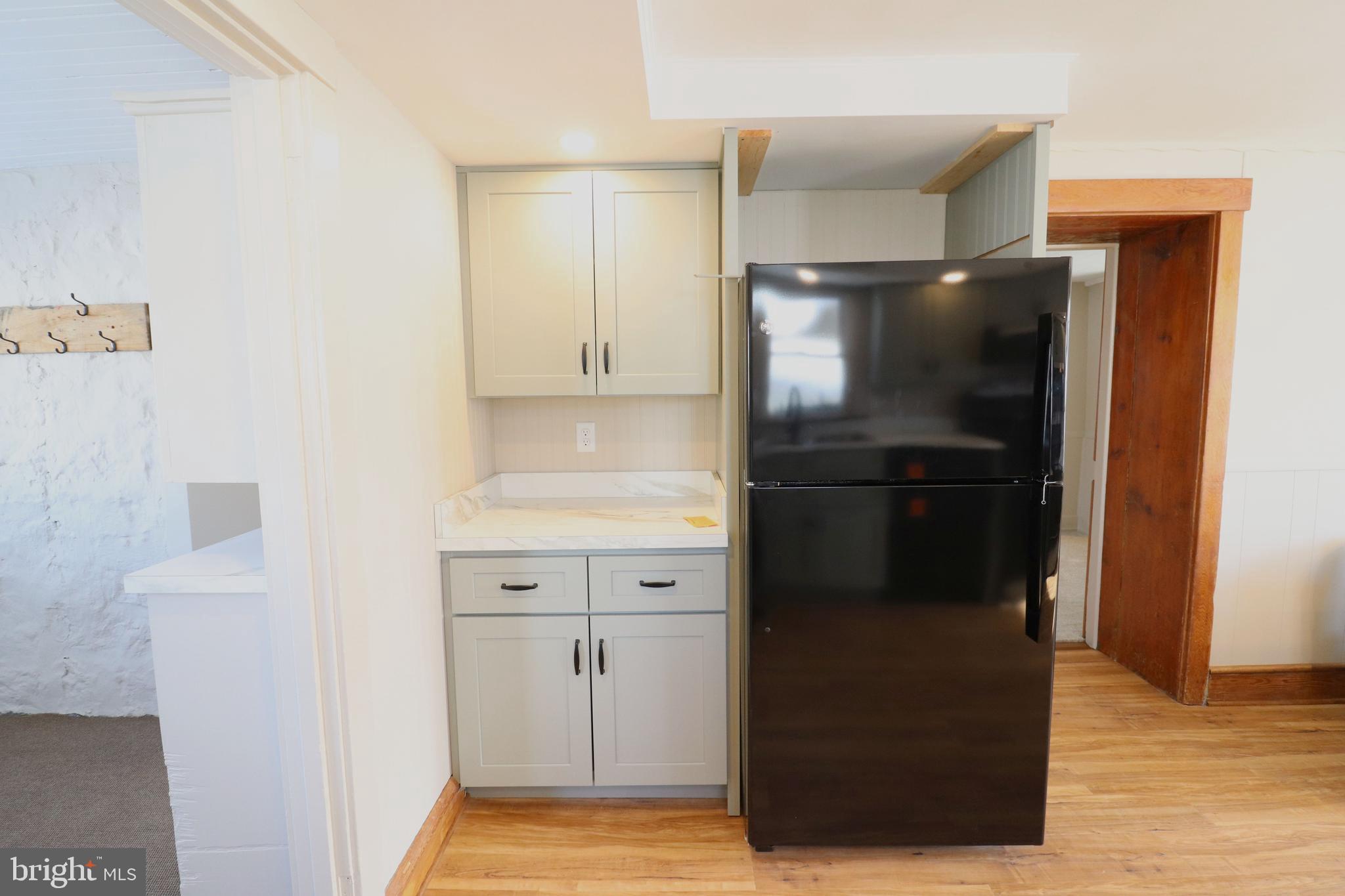 985 South Ridge Road Denver, PA 17517 - Photo 7 of 36 a kitchen with a refrigerator and a stove