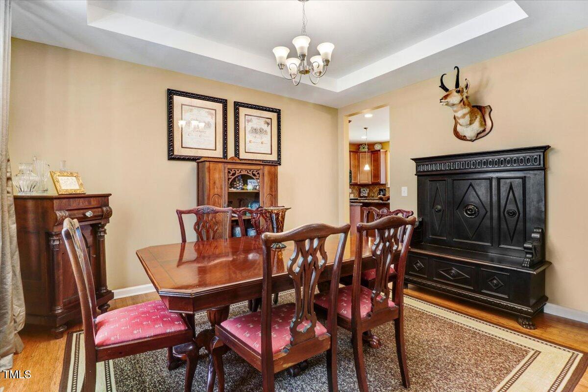 1304 Double Oak Lane Willow Spring, NC 27592 - Photo 9 of 46 a view of a dining room with furniture