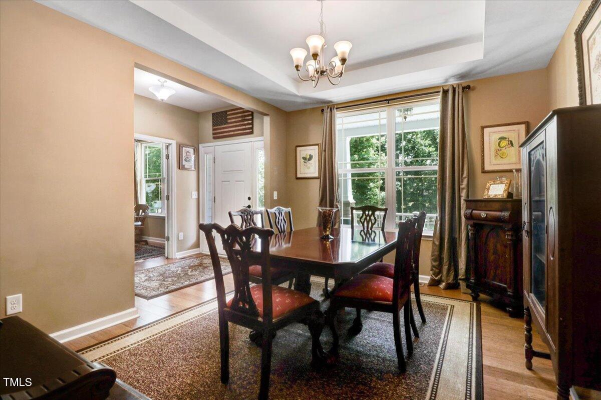 1304 Double Oak Lane Willow Spring, NC 27592 - Photo 10 of 46 a view of a dining room with furniture window and outside view