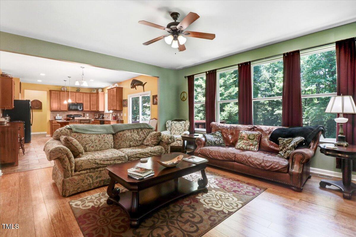 1304 Double Oak Lane Willow Spring, NC 27592 - Photo 14 of 46 a living room with furniture and a large window