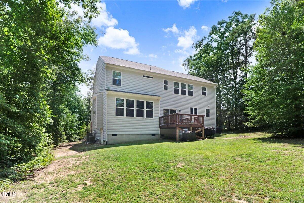1304 Double Oak Lane Willow Spring, NC 27592 - Photo 35 of 46 a view of house with backyard space and garden