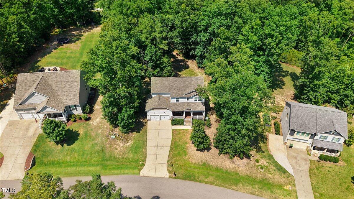 1304 Double Oak Lane Willow Spring, NC 27592 - Photo 43 of 46 an aerial view of a house with a yard and large tree