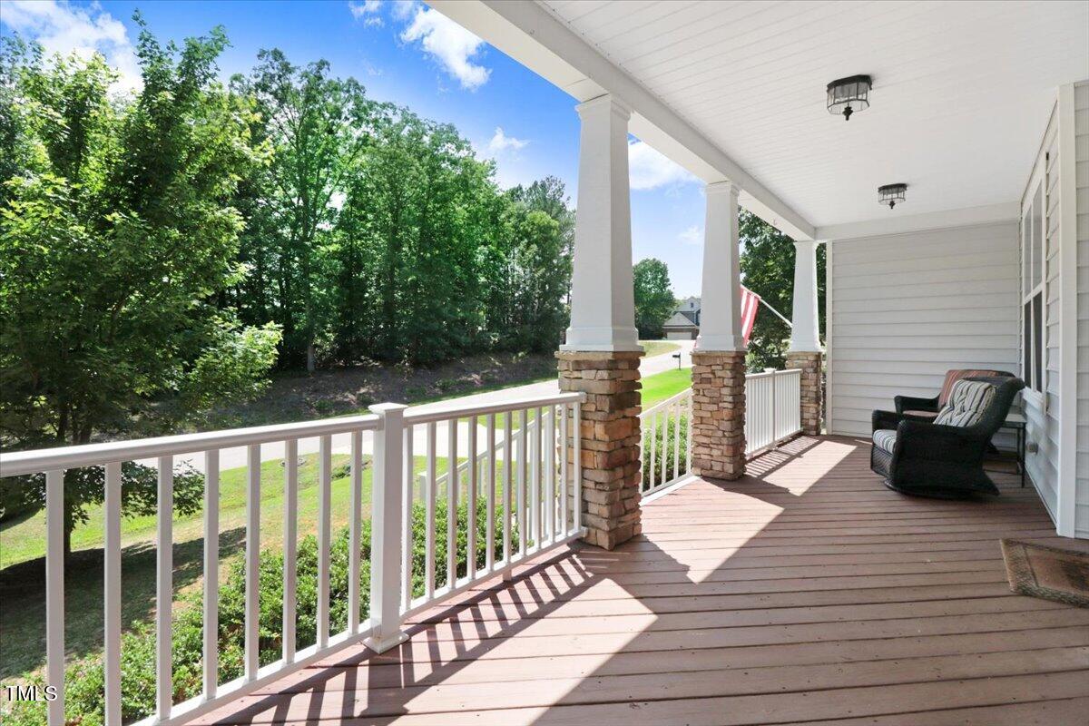 1304 Double Oak Lane Willow Spring, NC 27592 - Photo 4 of 46 a view of a balcony with wooden floor