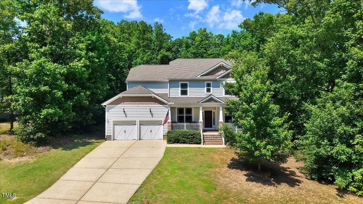 1304 Double Oak Lane Willow Spring, NC 27592 - Photo 5 of 46 a house view with a outdoor space