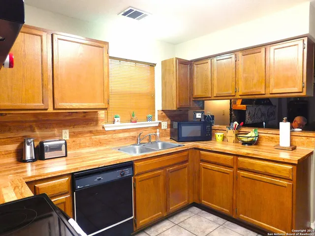 a kitchen with a sink and a window