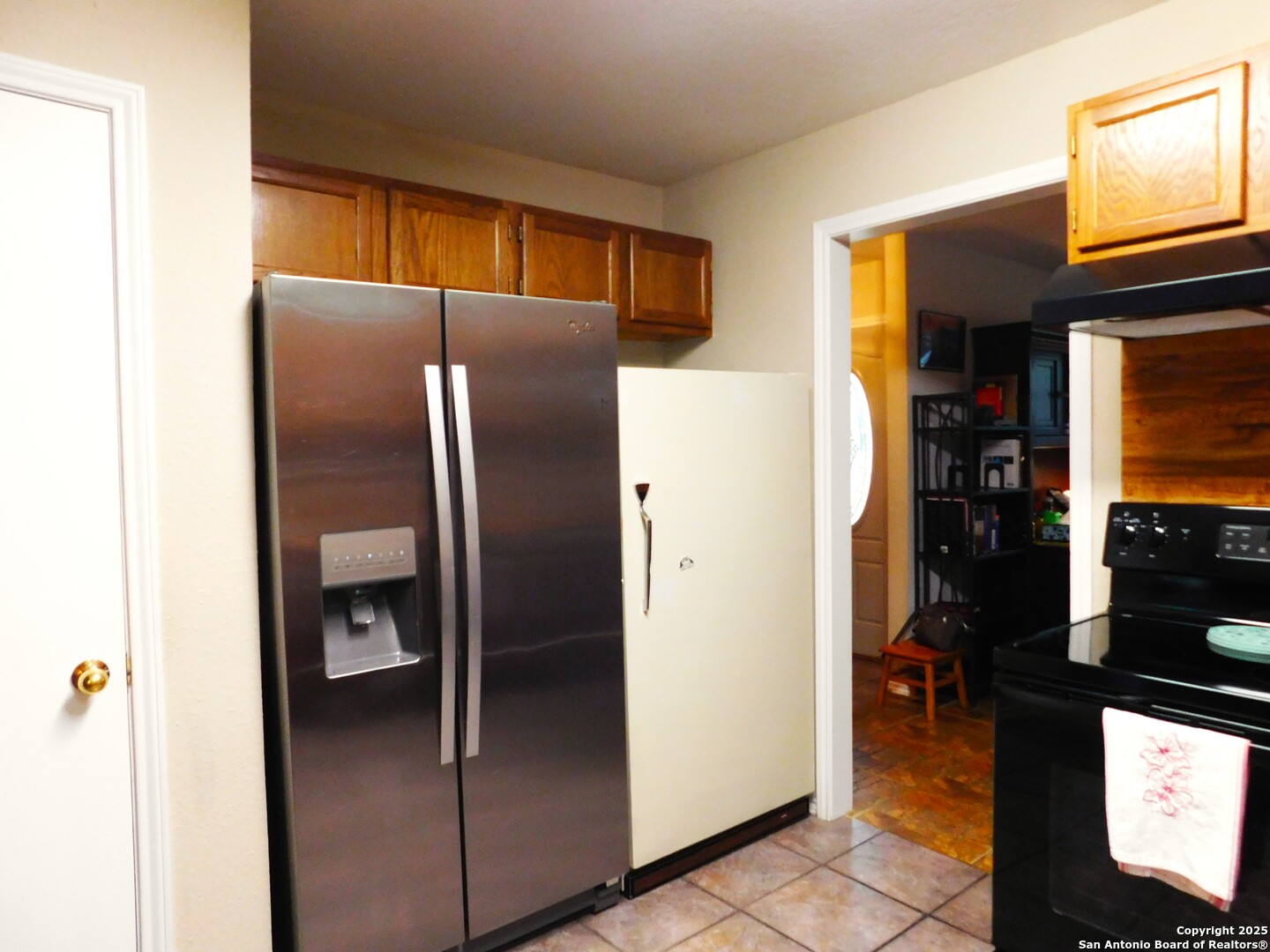 525 Cherry Ridge Floresville, TX 78114 - Photo 14 of 35 a metallic refrigerator freezer sitting in a kitchen