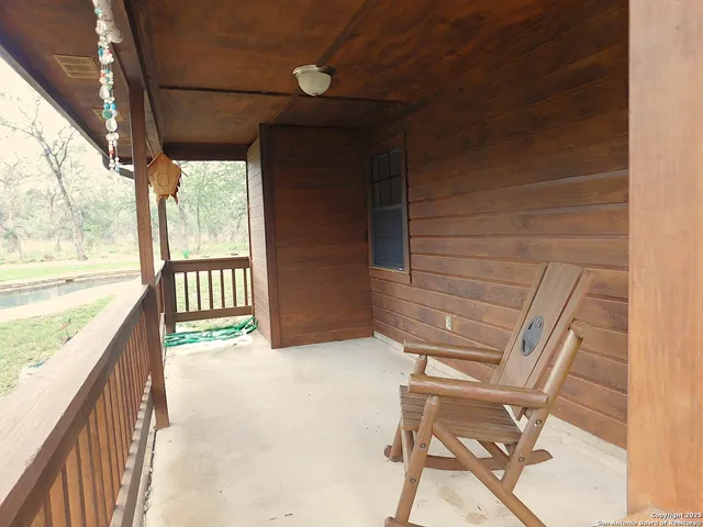 a view of balcony with furniture