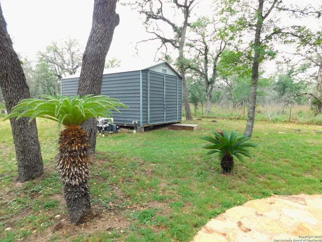 a view of a swimming pool with a patio