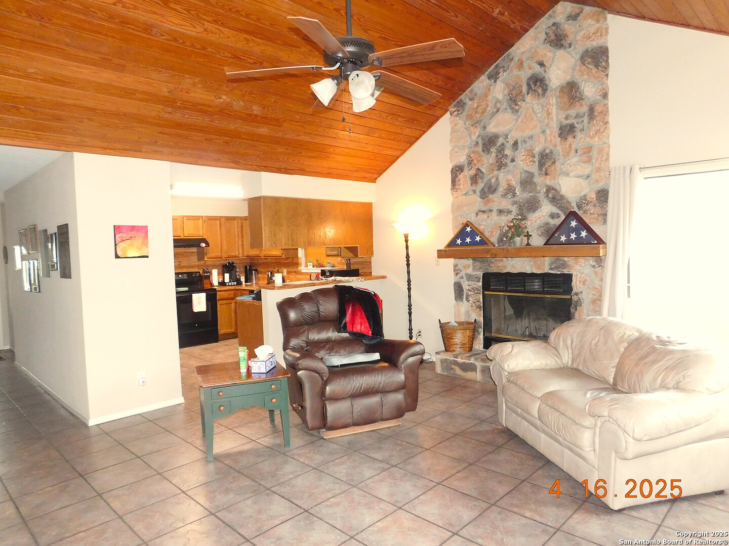 525 Cherry Ridge Floresville, TX 78114 - Photo 10 of 35 a living room with furniture and a fireplace