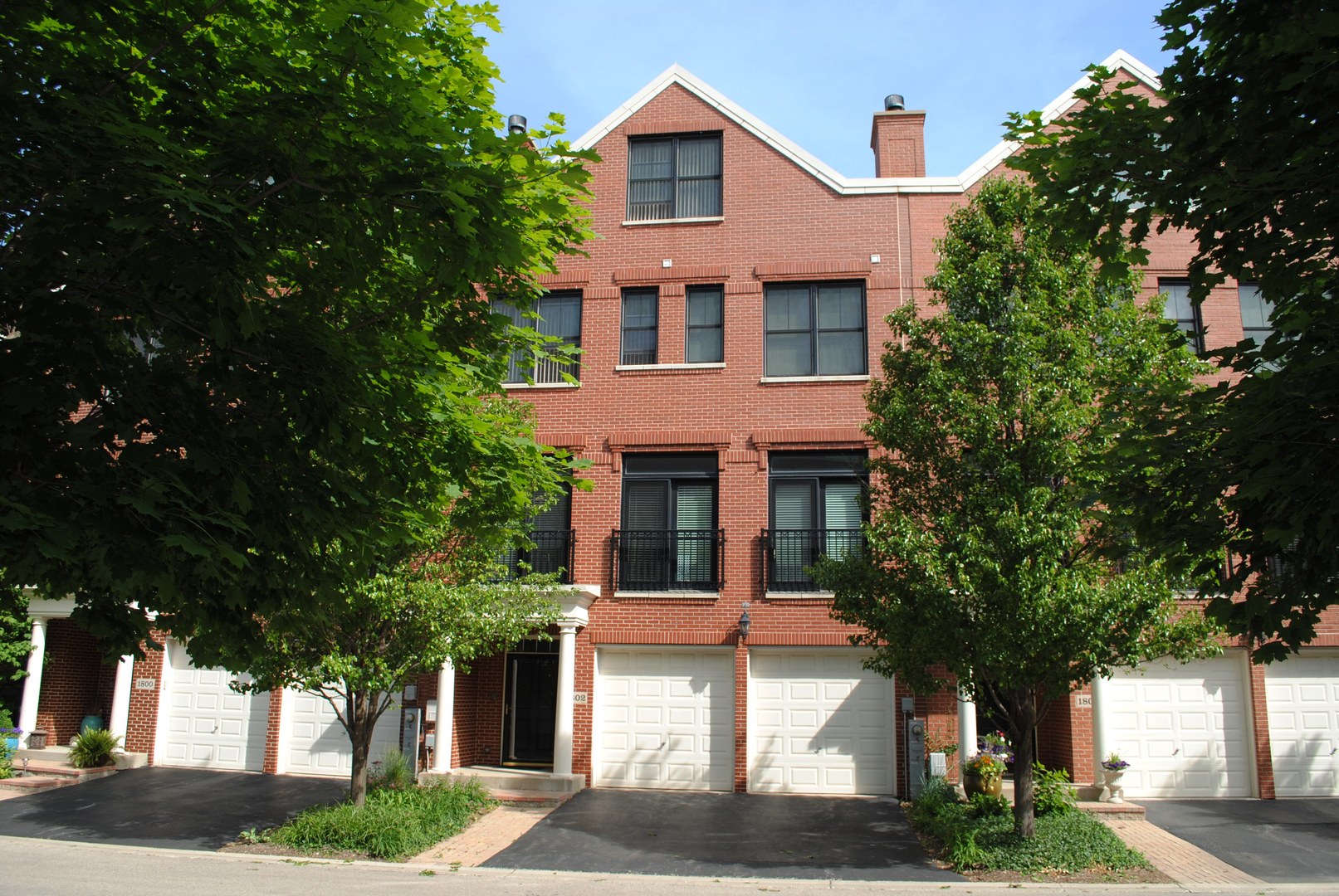 1802 Admiral Court Glenview, IL 60026 - Photo 1 of 18 a front view of a house with a garden