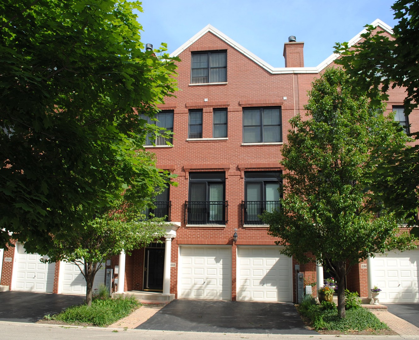 1802 Admiral Court Glenview, IL 60026 - Photo 2 of 18 a front view of a house with a garden