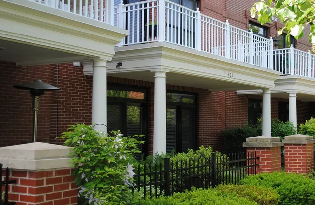 a view of a house with potted plants