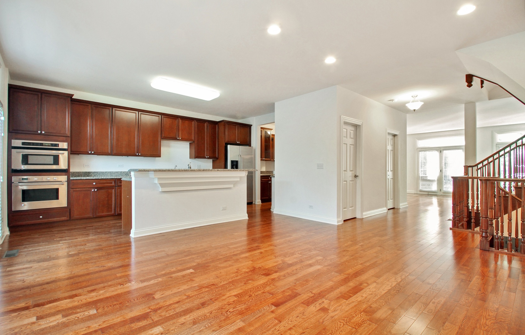 1802 Admiral Court Glenview, IL 60026 - Photo 8 of 18 a kitchen with stainless steel appliances a refrigerator and a stove top oven