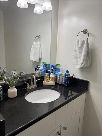 a bathroom with a sink double vanity and a mirror