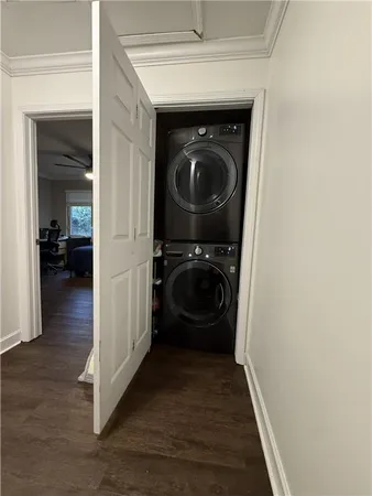 a view of a hallway with washer and dryer