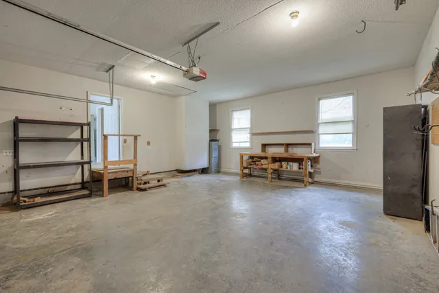 a view of a livingroom with furniture and a window