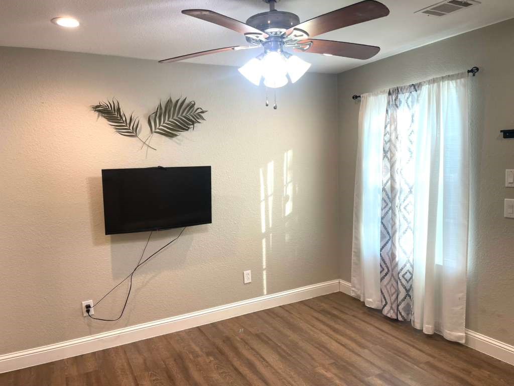 a view of a livingroom with a flat screen tv
