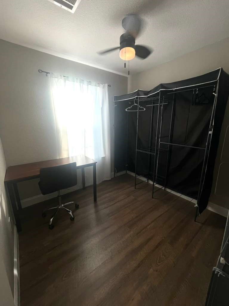 3807 Edison Street Houston, TX 77009 - Photo 6 of 11 a view of a room with wooden floor and windows